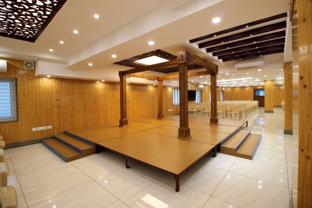 Marriage Halls in Mottur decorated wedding area with stage, seating, and floral arrangements